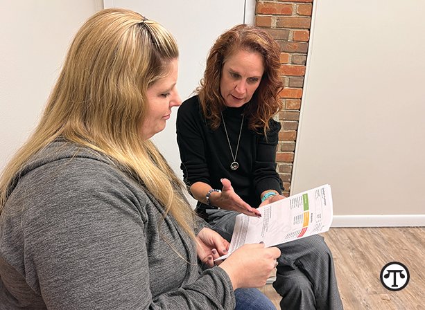 Michele Long, CNP, reviews the results of the GeneSight test with her patient, Beth. With a simple cheek swab, the test provides clinicians with a patient’s unique genetic information that indicates which medications may require dose adjustments, be less likely to work, or have an increased risk of side effects.